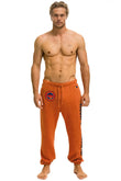 UNIVERSITY OF TEXAS UNISEX CIRCLE PRINT SWEATPANTS - BURNT ORANGE