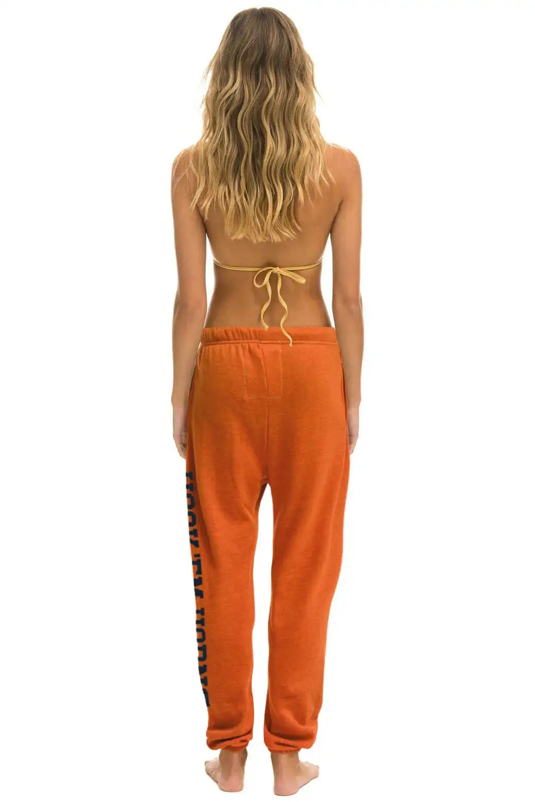 UNIVERSITY OF TEXAS UNISEX CIRCLE PRINT SWEATPANTS - BURNT ORANGE